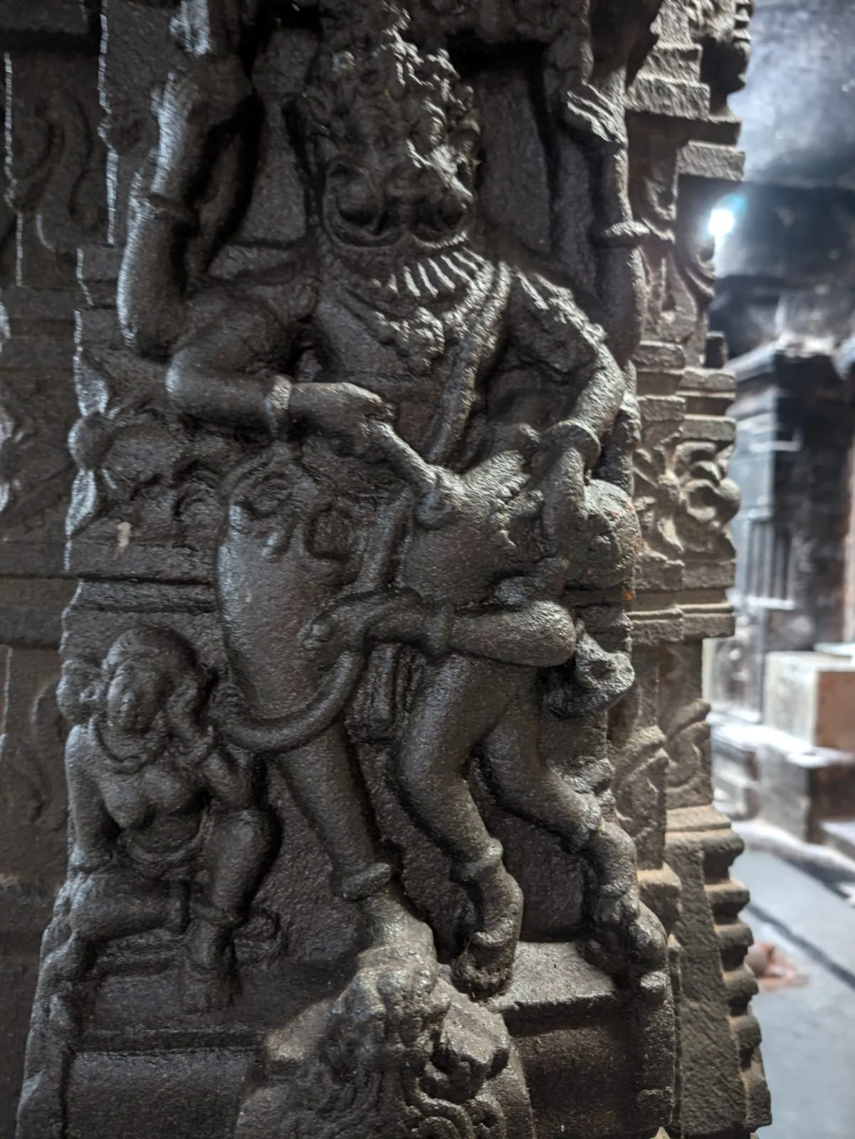 Narasimha on a temple pillar, with Hiranyakashipu across his lap